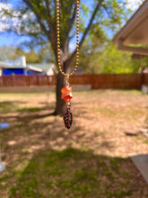 Load image into Gallery viewer, Crystal Swirl &amp; Feather Guardian – Tangerine Aura Quartz Necklace | Wire Wrapped Pendant for Joy &amp; Creative Energy
